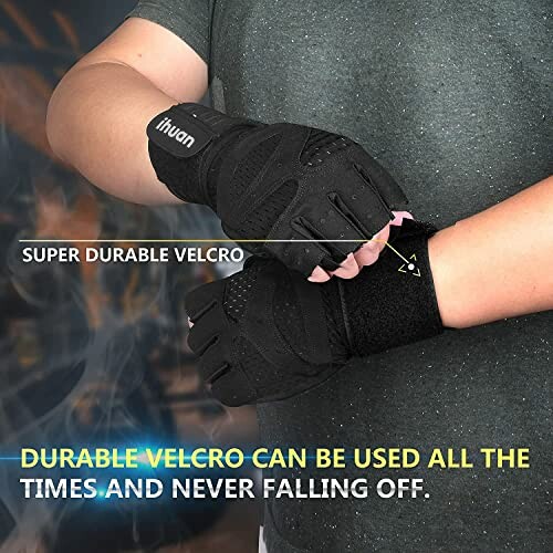 Person wearing black gym gloves with durable Velcro straps.