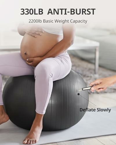 Pregnant woman sitting on an anti-burst exercise ball.