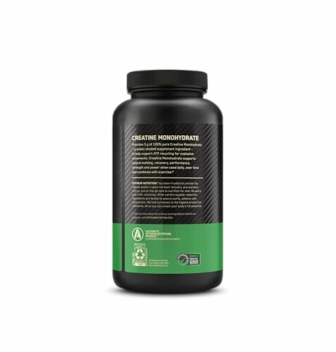 Black and green creatine monohydrate supplement bottle.