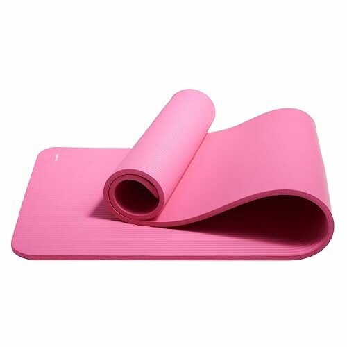 Rolled pink yoga mat