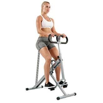 Woman using vertical exercise machine for workout